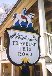 [photo, G. Washington Traveled this Road, sign marking old Post Road near Rodgers Tavern, Perryville, Maryland]